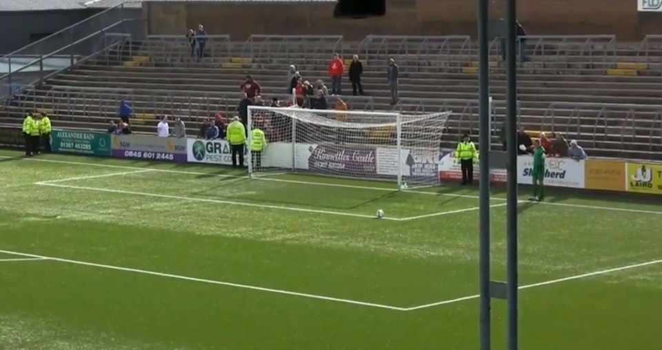  Rab Douglas gets abuse from fans behind him as he takes a goal kick at the end of the game