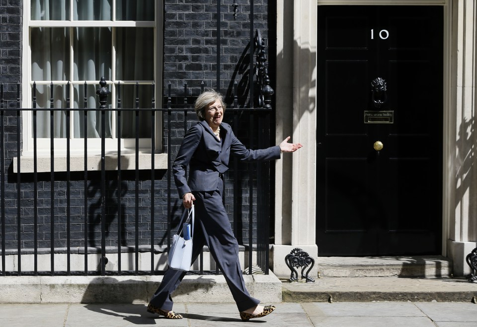  She jokes with photographers after she went the wrong way after stepping out of No10