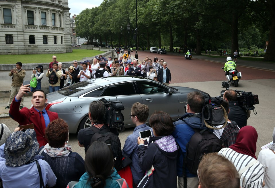  A car carrying the Prime Minister drives away from Downing Street after the meeting