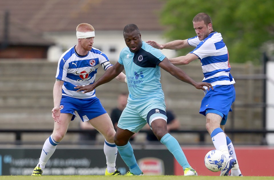  Former Everton and Middlesbrough man Yakubu still has the strength to hold of Reading players Paul McShane and Joey Van Den Berg