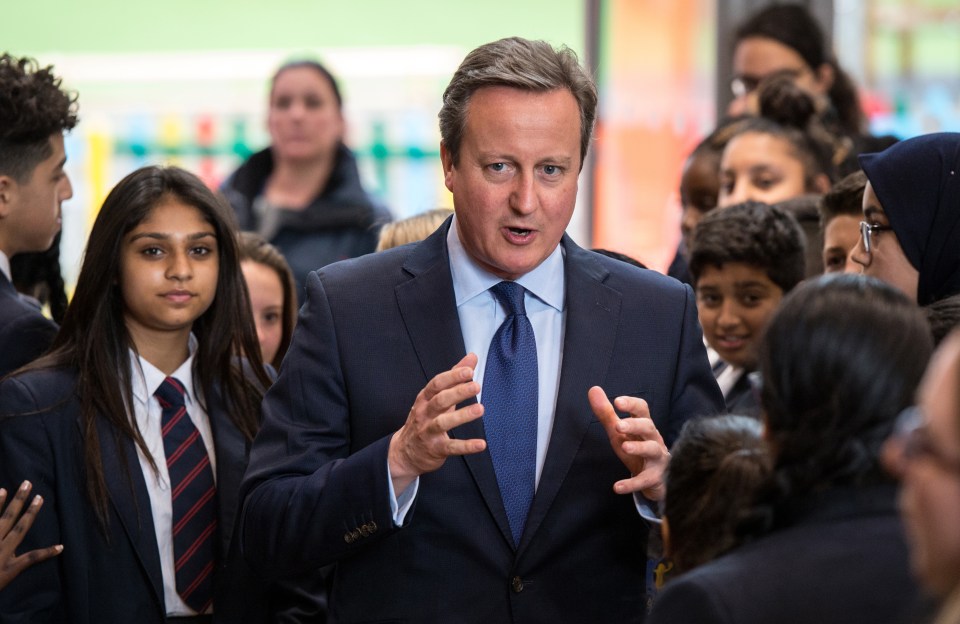  David Cameron talks to pupils during a visit to Reach Academy today