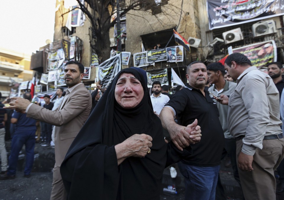  People grieve at the site of the deadliest attack in Baghdad in 13 years