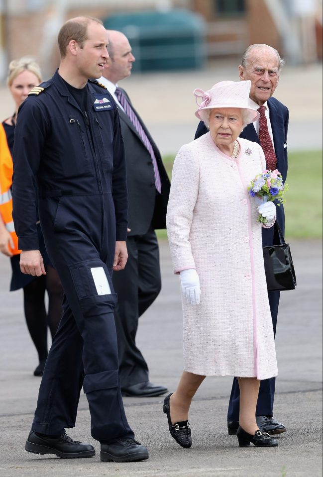 Dressed in a baby pink outfit, the Queen carried a pretty bouquet she had been gifted, as she talked to her grandson pilot