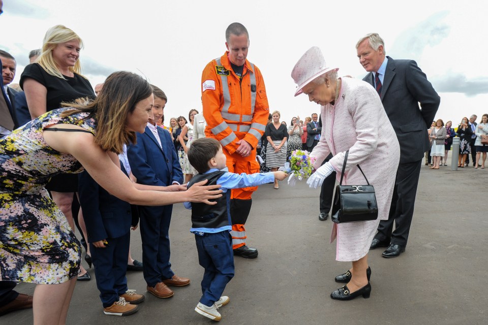 The Queen was gien a bouquet from two-year-old Pepe Casanov at the new air base