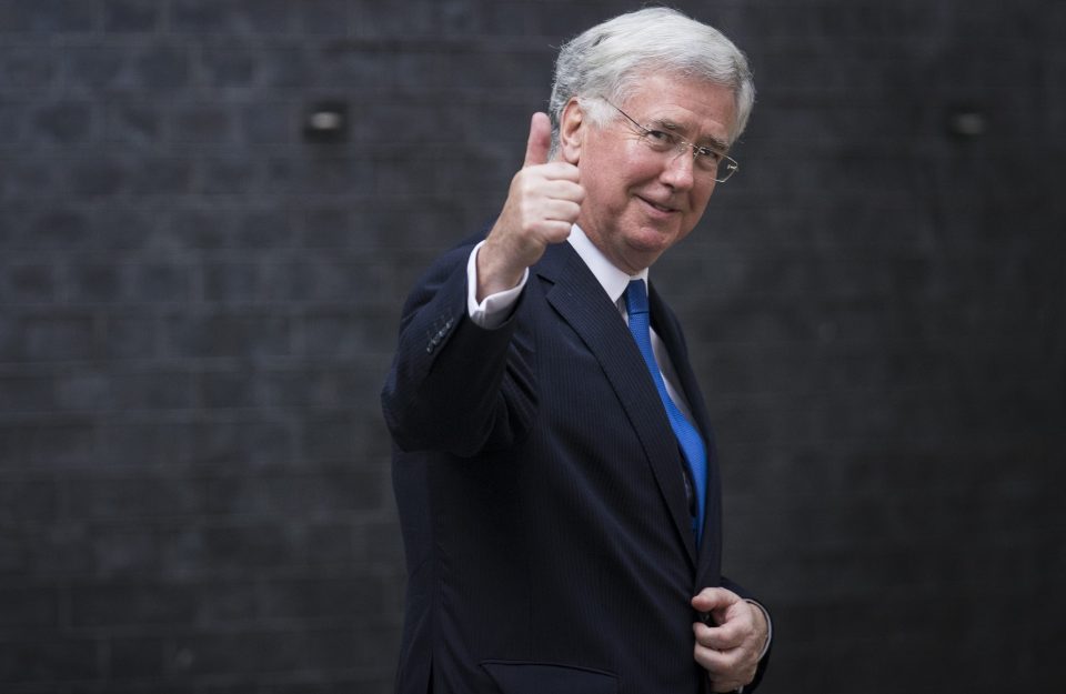  Michael Fallon clung to his role as Defence Secretary, giving media a thumbs up after visiting Theresa May at No10