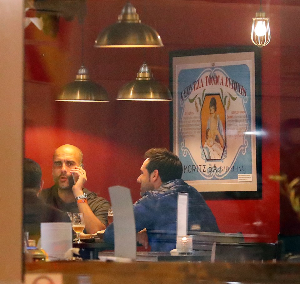  Manchester City boss Pep Guardiola takes a call at Lunya Tapas Bar