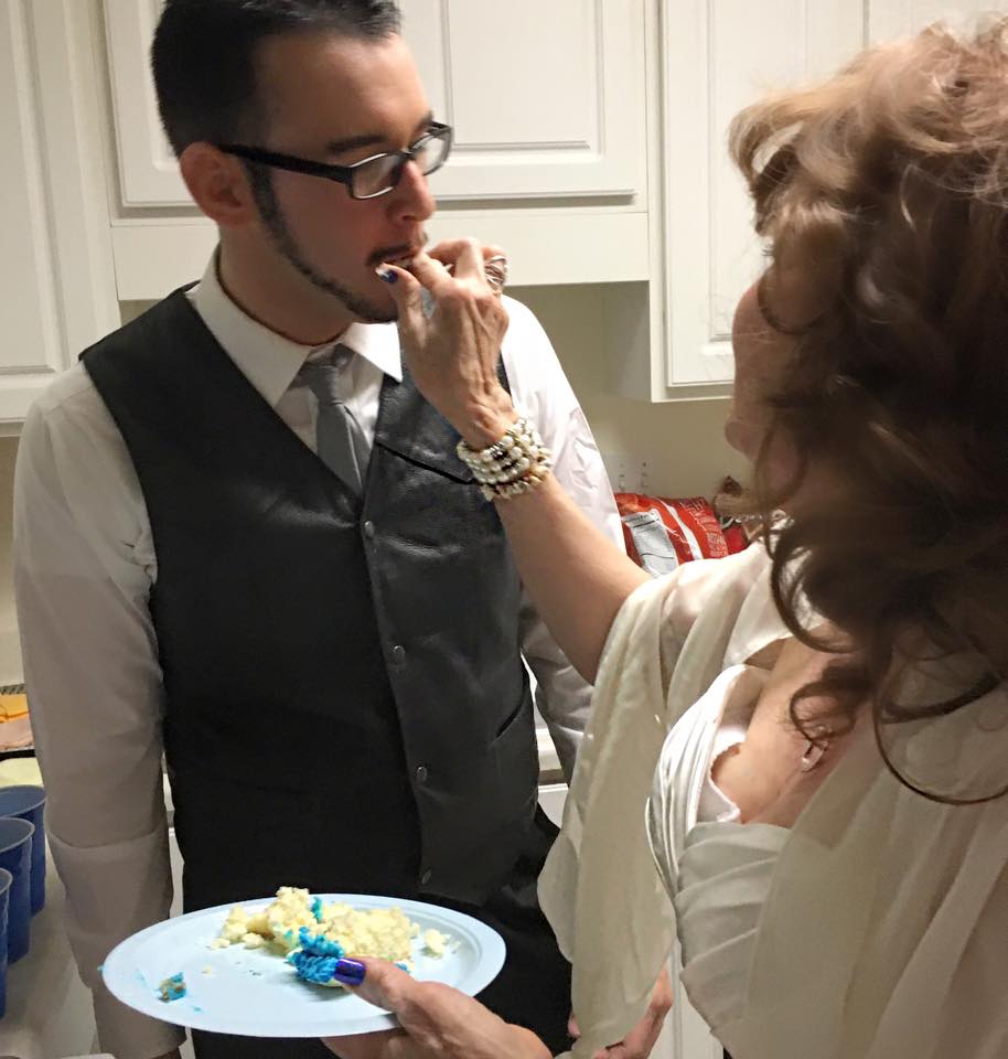  Gary and Almeda share a wedding cake at the reception, held in Lisa's garden