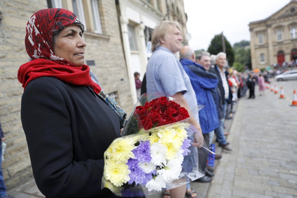 Hundreds of people gather with flowers to line the streets of Jo's constituency as her private funeral begins