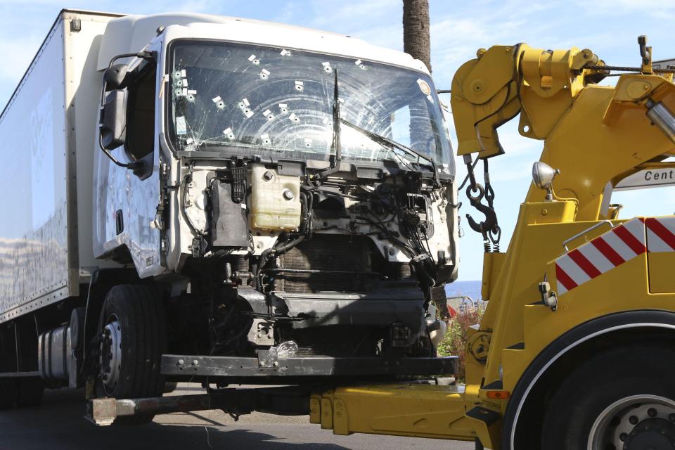 The truck involved in the fatal attack on the streets of Nice is being towed from the scene