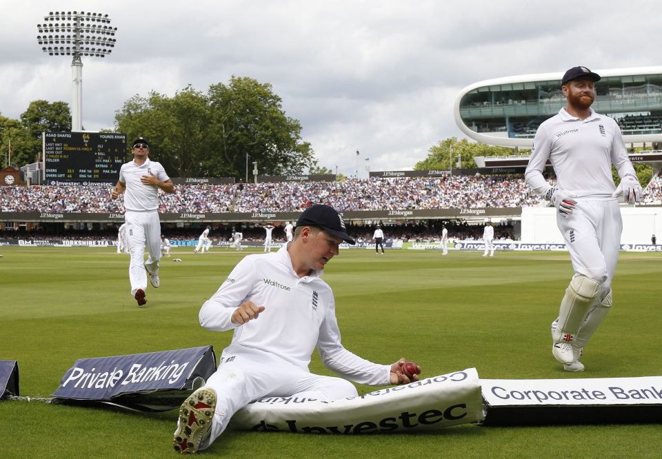 Alastair Cook (L), Gary Ballance (C) and Jonny Bairstow fail to stop Asad Shafiq hitting a four during his 49 