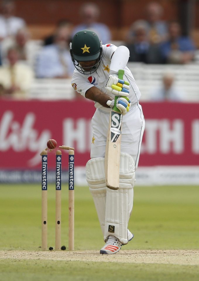 Asad Shafiq is bowled by England's five-wicket paceman Chris Woakes on a fluctuating third day