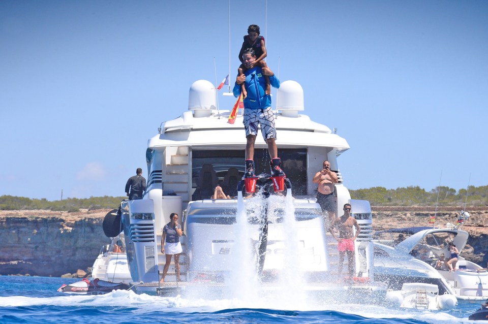  Reach for the sky ... Cris Jnr hits the heights while dad watches on