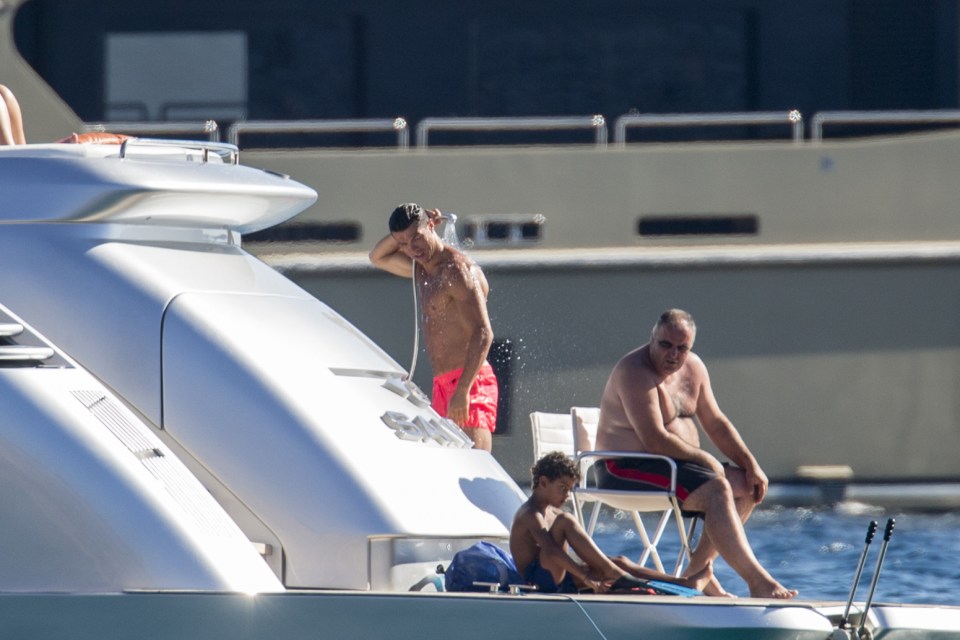  Cristiano Ronaldo cools himself off as he tops up his tan on a mega-yacht