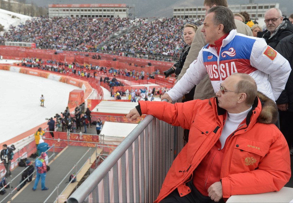 Vladimir Putin and sports minister Vitaly Mutko watch the 2014 Olympics in Sochi