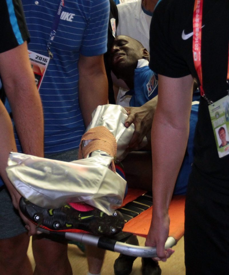 Demba Ba lies on a stretcher after his leg break on Sunday