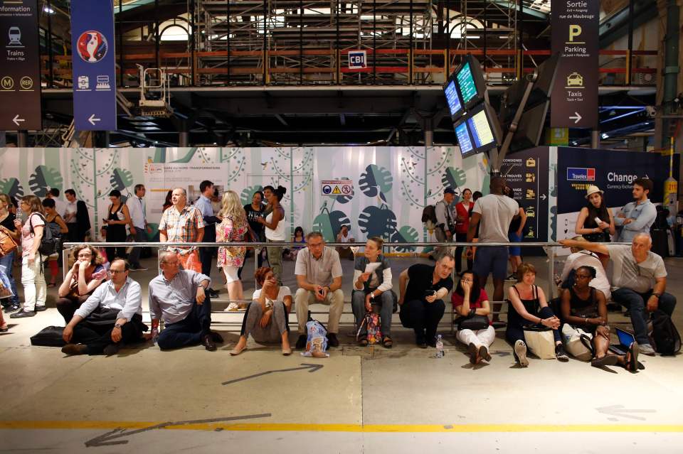 People wait at the Gare du Nord train st