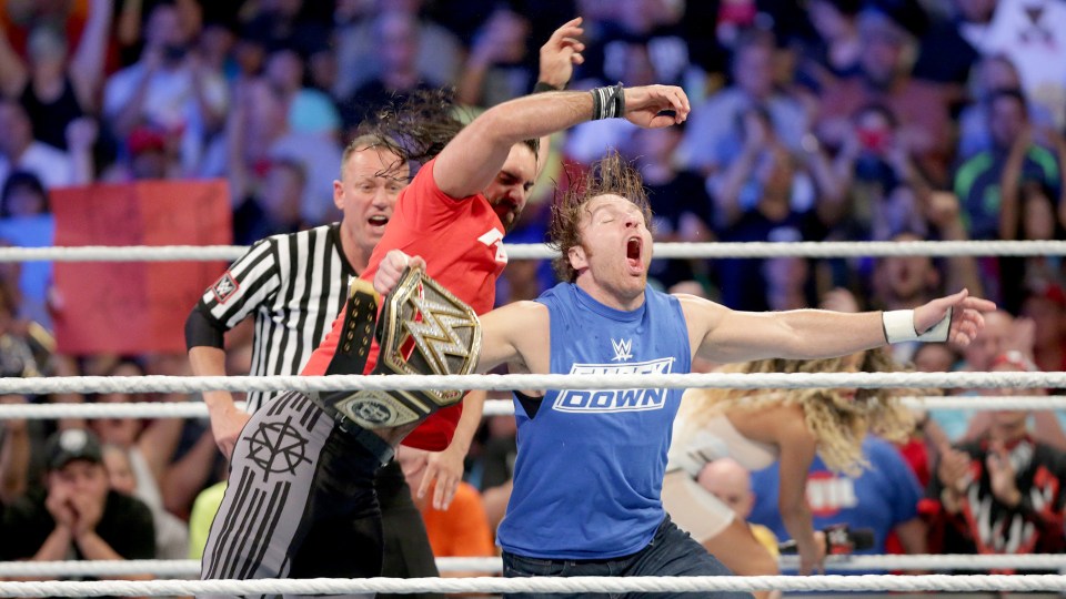 Seth Rollins attacks his opponent Dean Ambrose