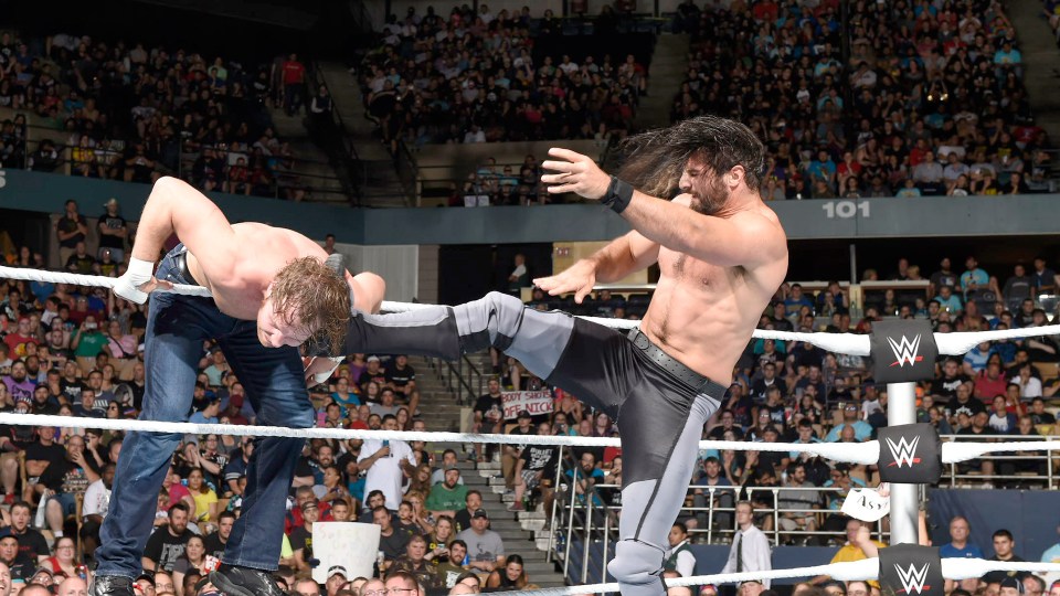 Seth Rollins lands a kick on WWE champion Dean Ambrose