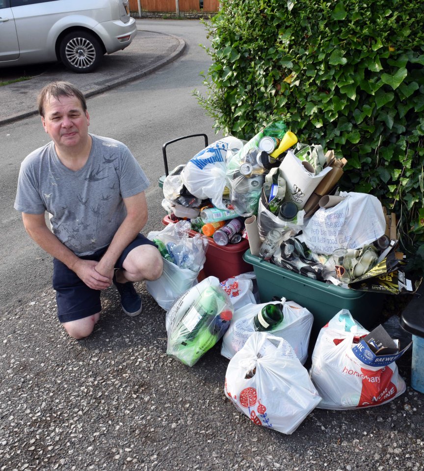  Stephen Ellis can barely cope with being so close to the piles of stinking rubbish, made worse by the hot weather