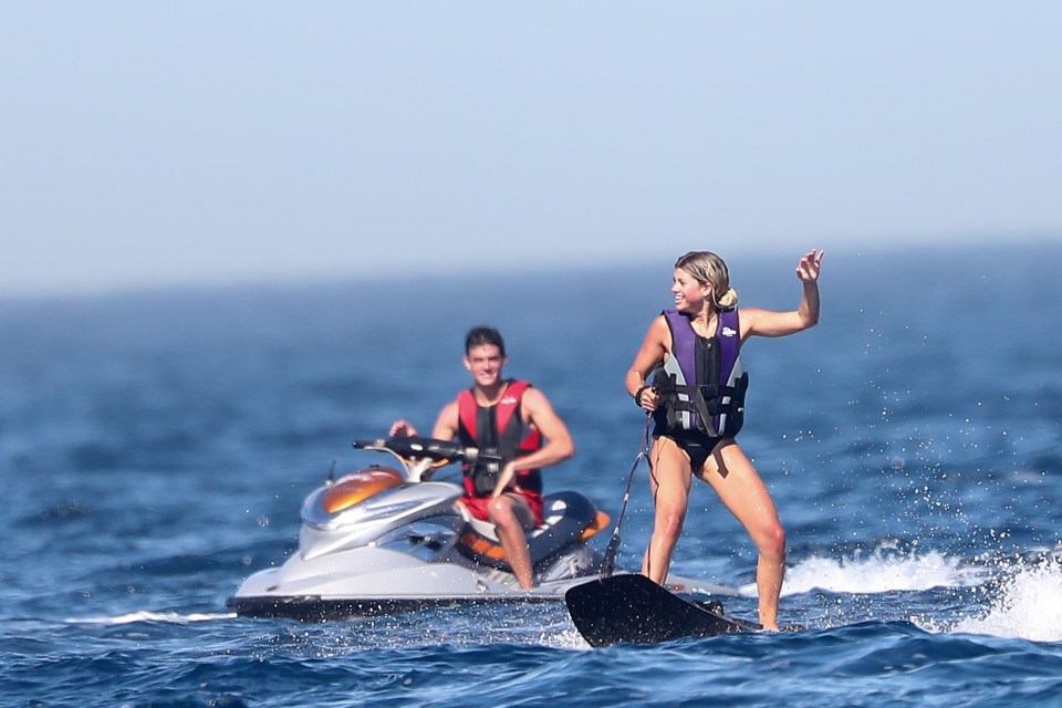  Sofia smiled as she got the hang of wake boarding