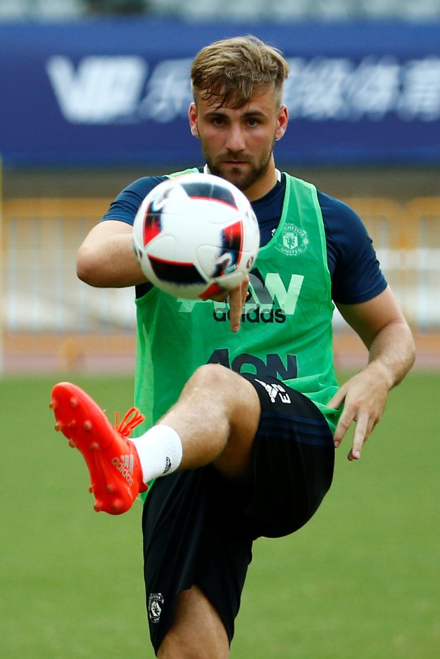 Luke Shaw passes the ball at Shanghai Stadium as he continues his comeback from a broken leg