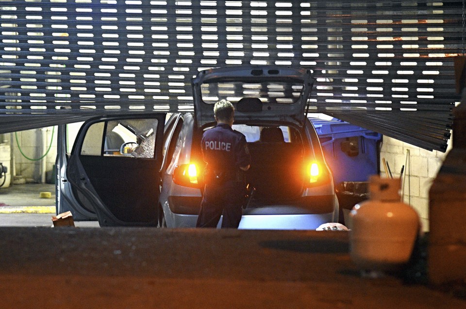  Images of the car wedged beneath the shutter of the police station's car park were released by local media