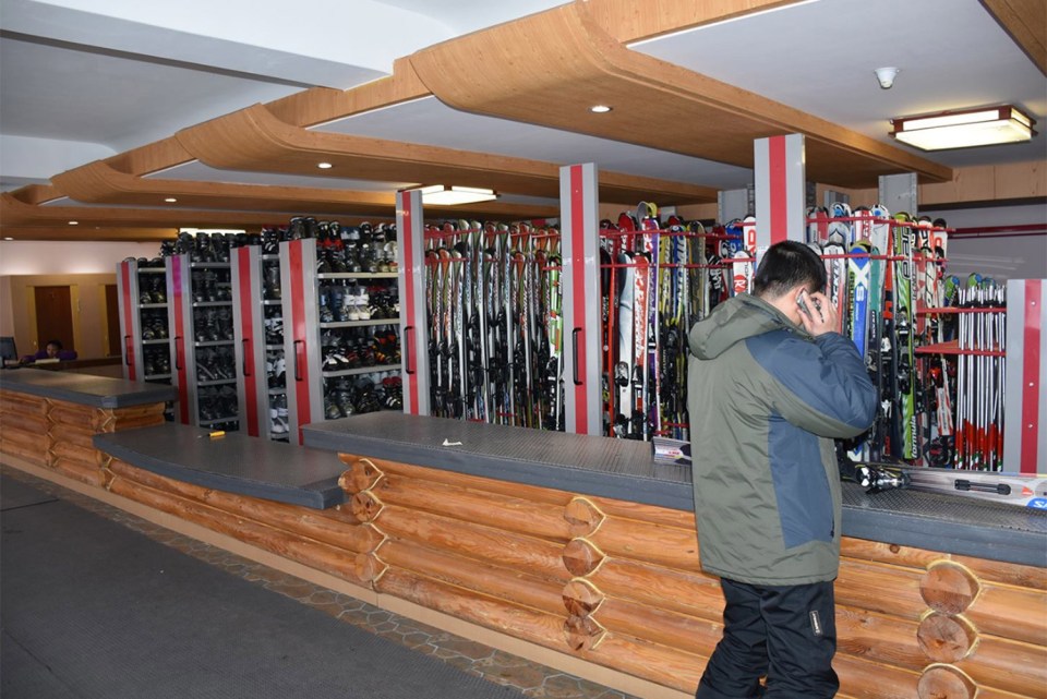  A visitor collects his skis at the Masikryong ski resort in North Korea