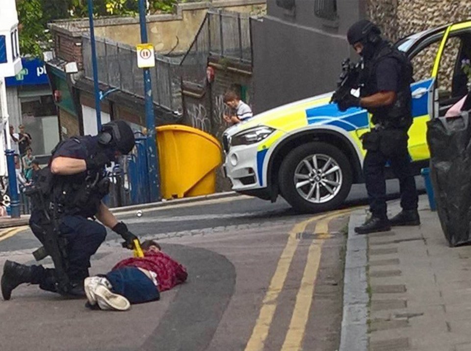  Armed police point a submachine gun at the head of a suspect in Ramsgate, Kent