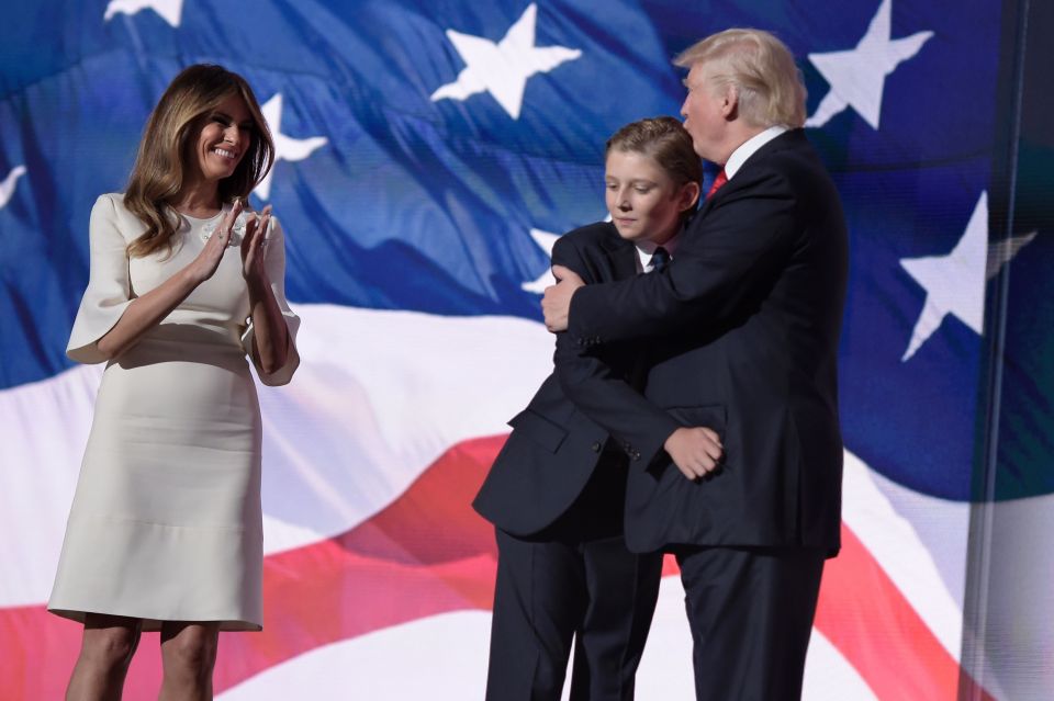  Donald Trump hugs his son Barron next his wife Melania Trump at the end of the Republican National Convention