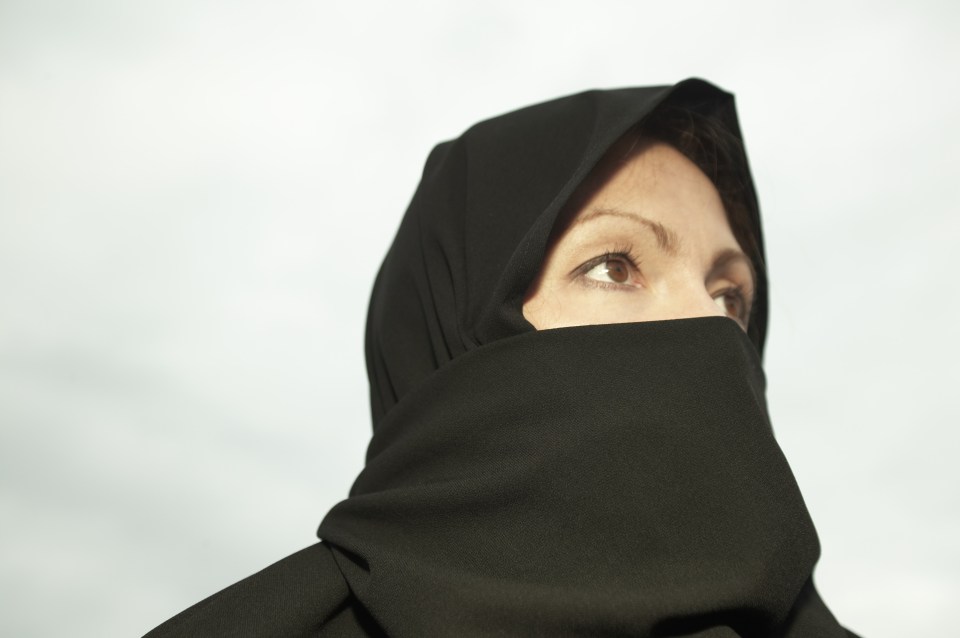 The woman started to wear a veil covering her whole face after being diagnosed with cancer (stock image)