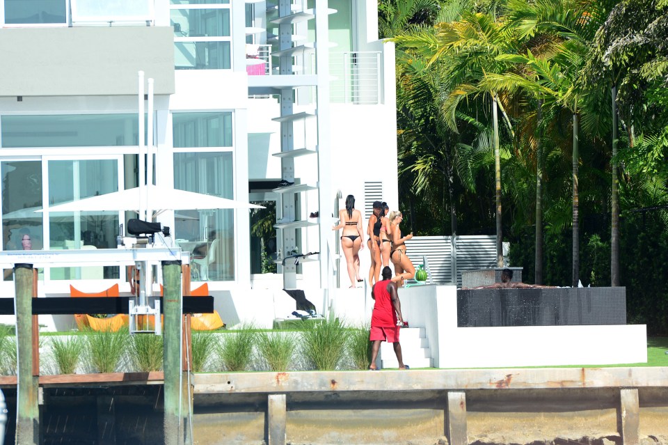 A bevy of bikin-clad girls partied with the players at the Miami mansion