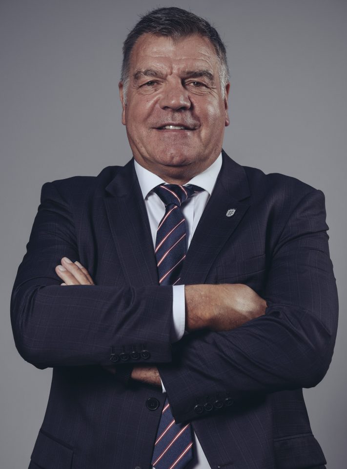  Sam Allardyce poses proudly wearing the England manager's suit for the first time