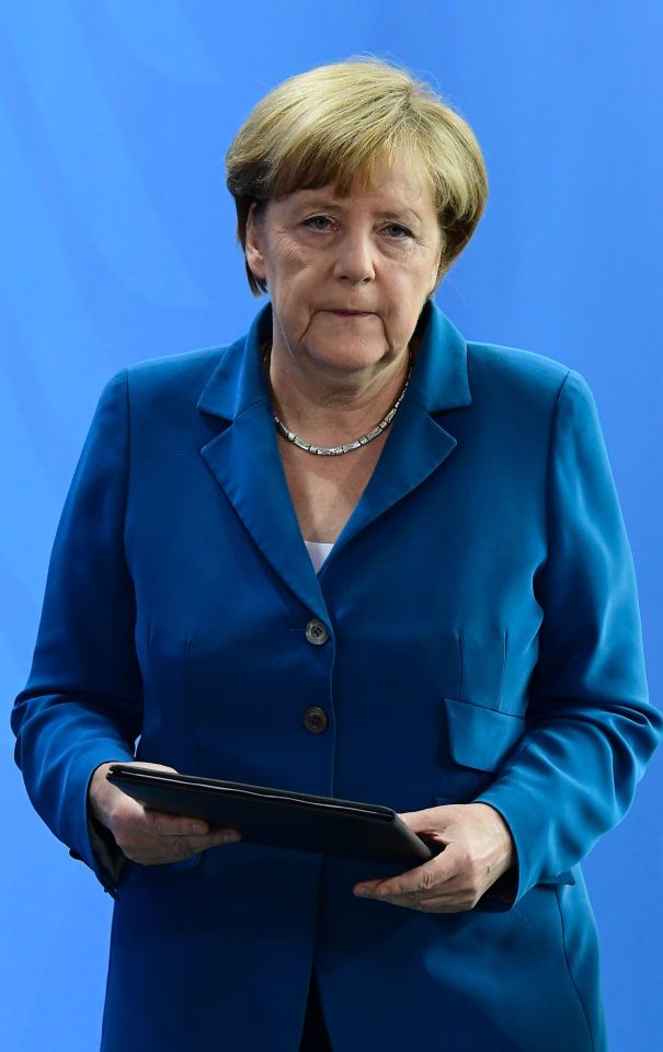 German Chancellor Angela Merkel gives a