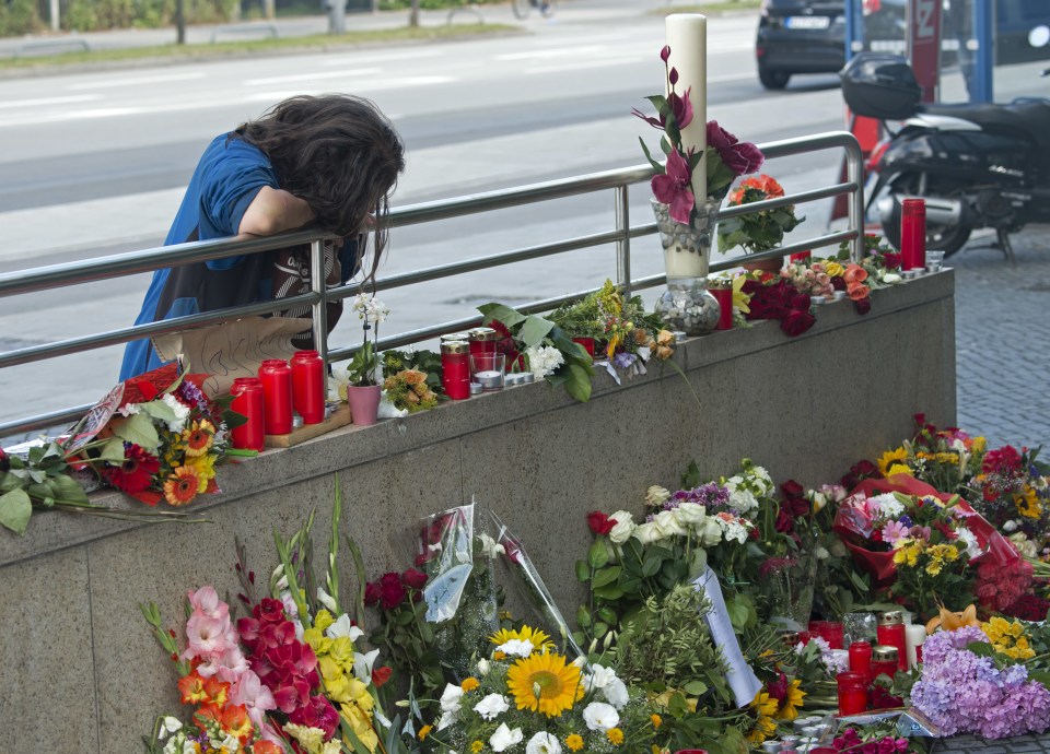  Flowers and candles have been laid outside the Munich mall, as more details emerge about Sonboly and his life before he unleashed the attack