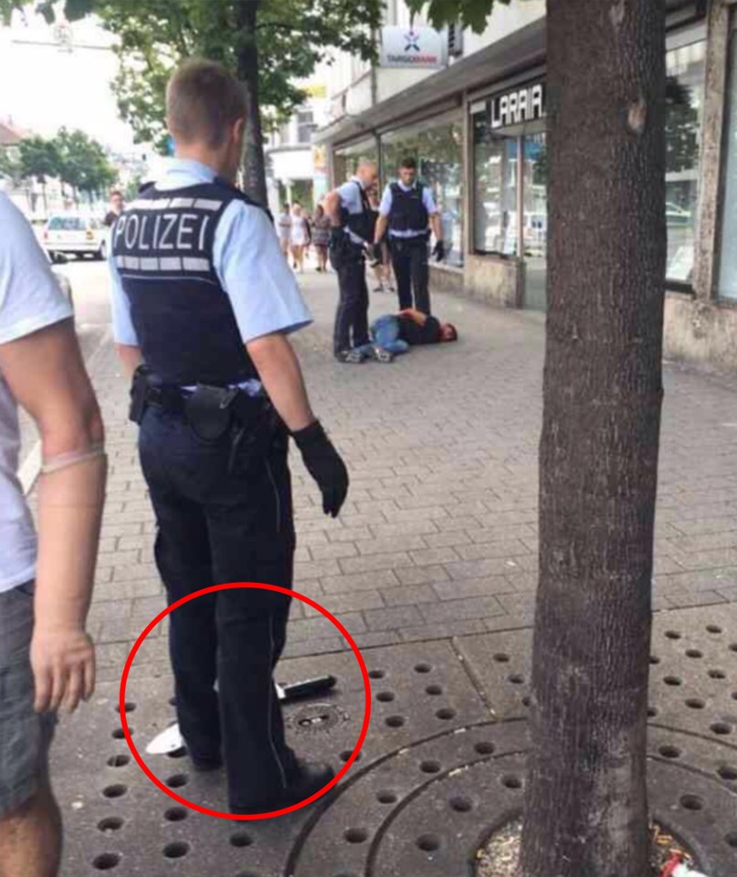  A knife can clearly be seen at the feet of a police officer at the scene of the attack