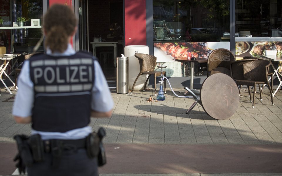  Police cordoned off the area, where a table could be seen overturned following a scuffle