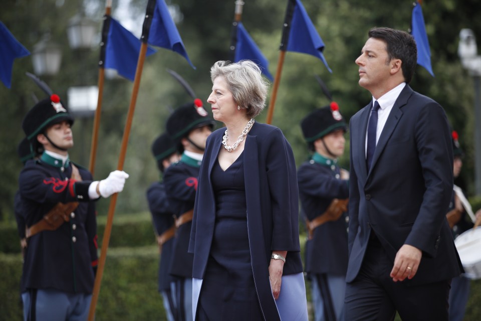  Theresa May was warmly received by the Italian Premier Matteo Renzi as she met him to discuss Brexit