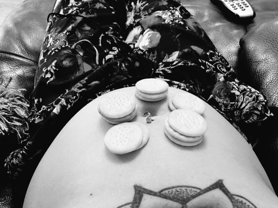 She also shared a snap of herself balancing biscuits on her baby bump