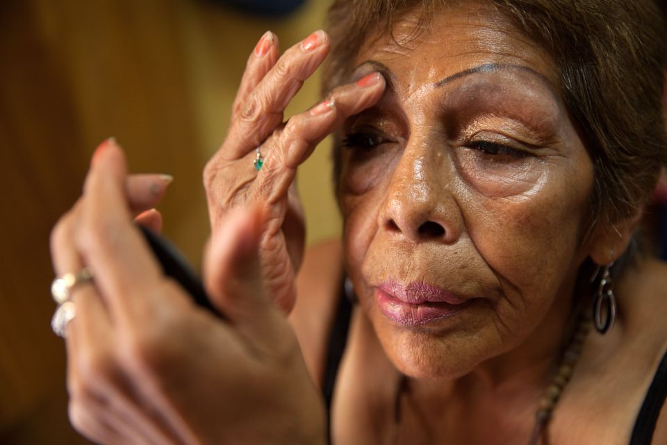  Luchita is one of those who use the shelter in Mexico's capital. Here she applies make-up in her bedroom