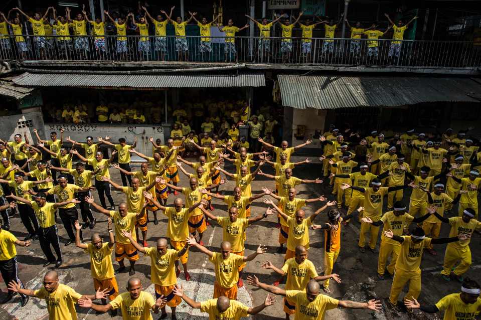  Group dance contests help the prisoners get some relief from the squalor