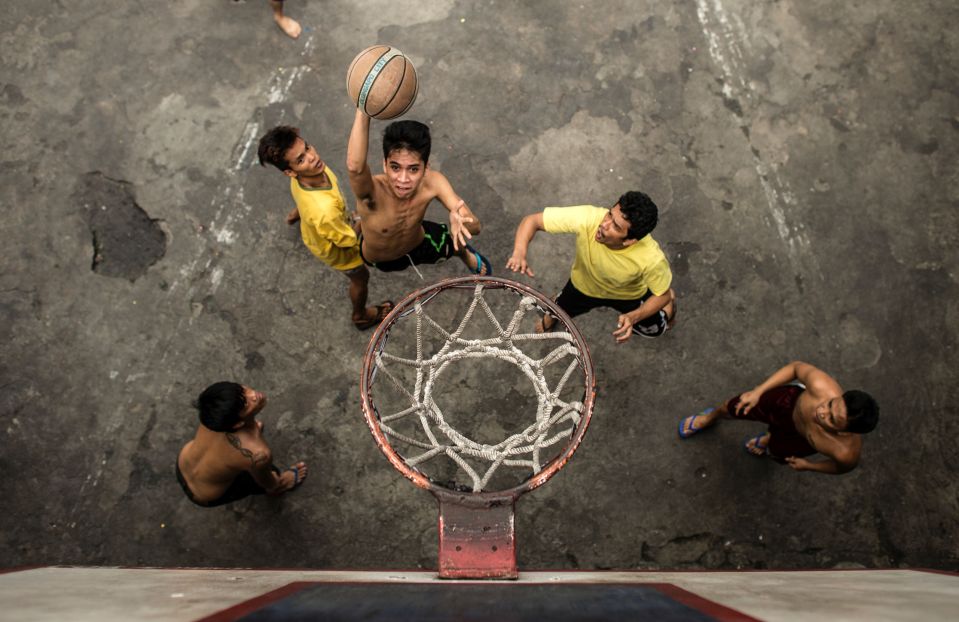  Inmates play basketball inside the Quezon City Jail in a rare moment of joy