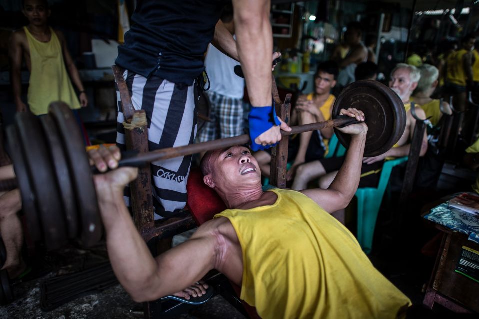  An inmate lifts weights at a gym inside the Manilla jail