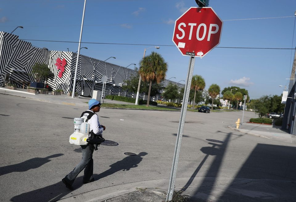 Sharon Nagel, a Miami-Dade County mosquito control inspector, walks through the Wynwood neighborhood looking for mosquitos or breeding areas 