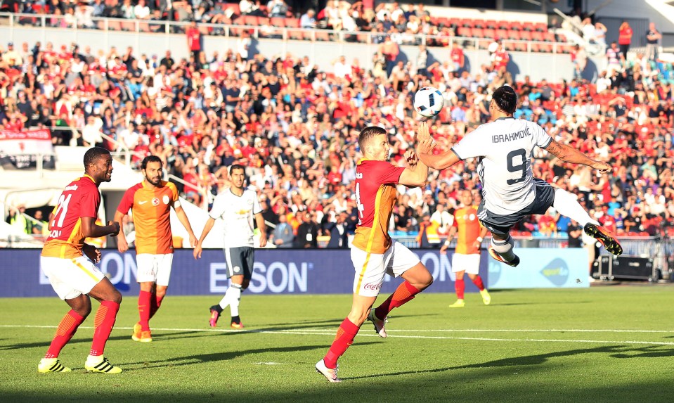 Zlatan Ibrahimovic leaps into the air as he gets ready to smash a scissor kick against Galatasaray