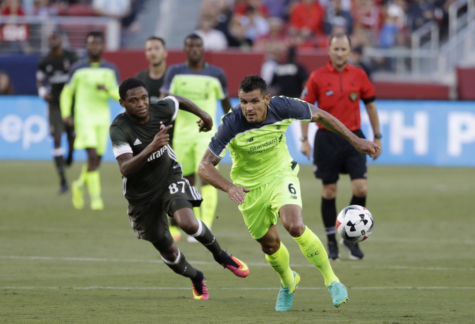 Liverpool's Dejan Lovren (6) chases the ball as AC Milan's Luiz Adriano pursues during the first half of an International Champions Cup soccer match Saturday, July 30, 2016, in Santa Clara, Calif. (AP Photo/Marcio Jose Sanchez)