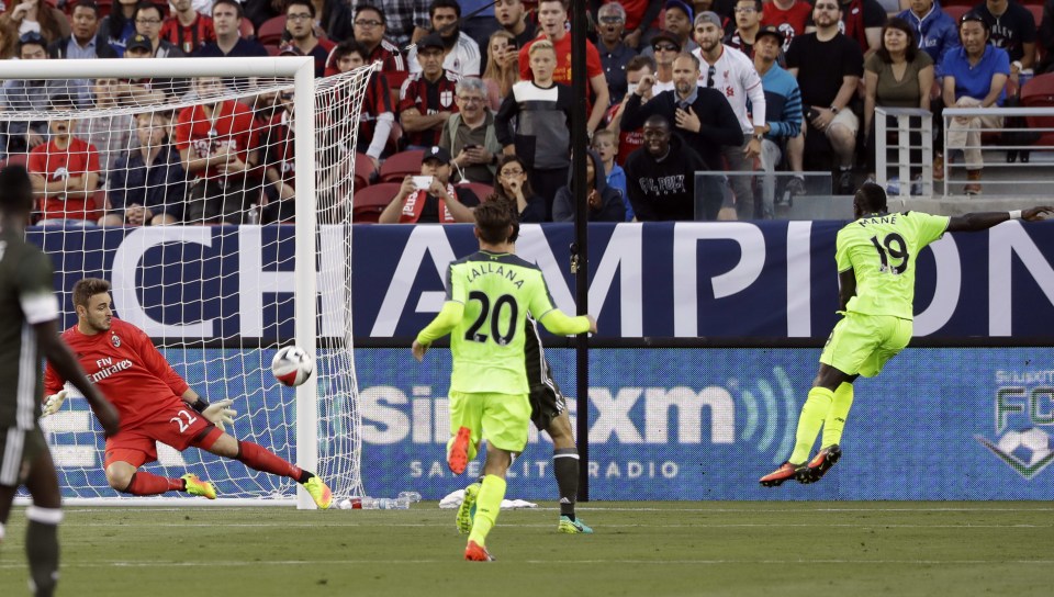 Saido Mane has an effort which is blocked by AC Milan goalkeeper, Gabriel