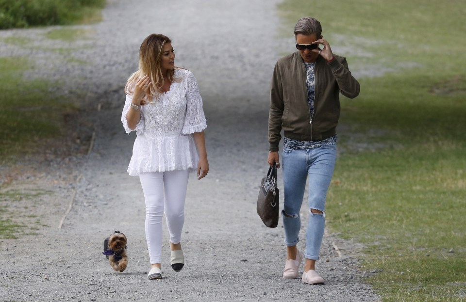 She wore matching skintight jeans for her stroll with Bobby