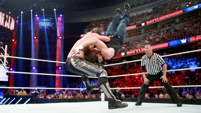 Rollins plants Ambrose with a broken arrow suplex