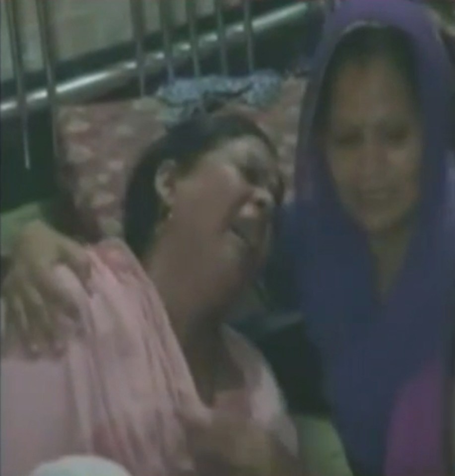 The crying mother of one of the children killed in the freak accident caused by glass-coated string from kites