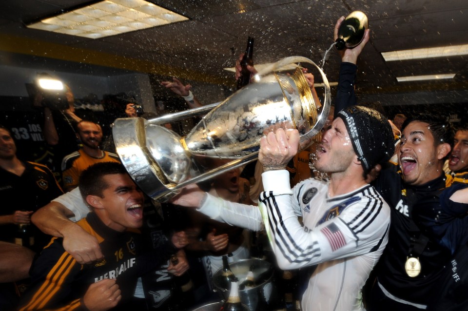 CARSON, CA - DECEMBER 01: David Beckham #23 of Los Angeles Galaxy drinks out of the MLS Trophy after the Galaxy defeat the Houston Dynamo 3-1 to win the 2012 MLS Cup at The Home Depot Center on December 1, 2012 in Carson, California. (Photo by Harry How/Getty Images)